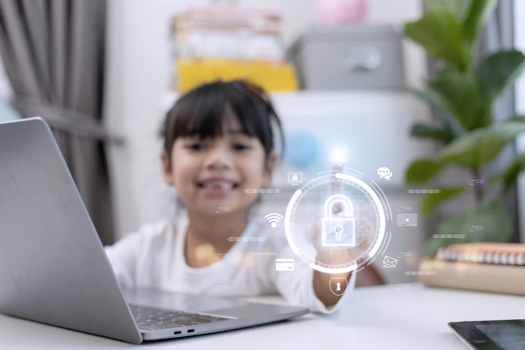 A Child using laptop for e-learning with data privacy overlay depicting safety online.