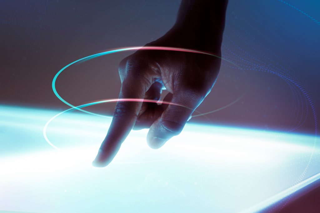 A hand of a man using virtual screen advanced technology digital remix showing innovation & Tradition in School
